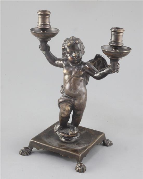 A Renaissance bronze candelabrum modelled as a cherub, height 9.25in.